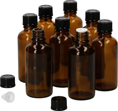 A collection of amber glass dropper bottles with black and white caps, arranged on a white background.