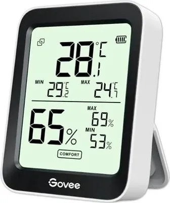 A digital thermometer and hygrometer displaying temperature and humidity readings.