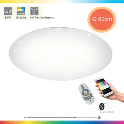 A white, oval-shaped ceiling light with small sparkling details, shown with a remote control and a smartphone displaying color options.