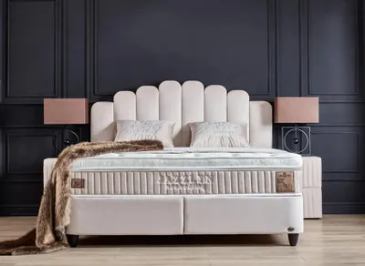 A bed with two nightstands in a bedroom setting.