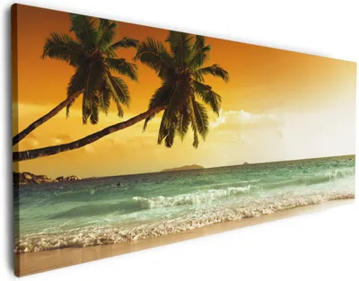 Produktbild von Wallario Premium Leinwandbild Palmen am Sandstrand bei untergehender Sonne in Größe 60 x 150 cm