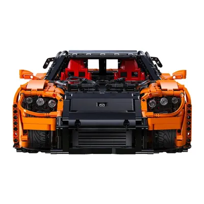 Front view of an orange and black Lego-like car model.
