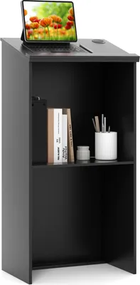 A black podium with a laptop on top and books on the shelf.