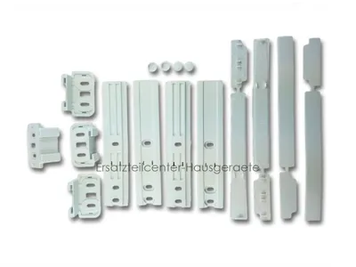 A collection of white plastic appliance parts, likely for a refrigerator or freezer door, arranged on a white background.