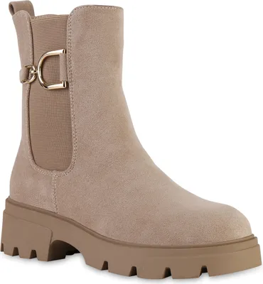 A single beige suede chelsea boot with a lug sole and a gold buckle detail.