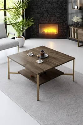A living room scene with a fireplace, sofa, and coffee table.