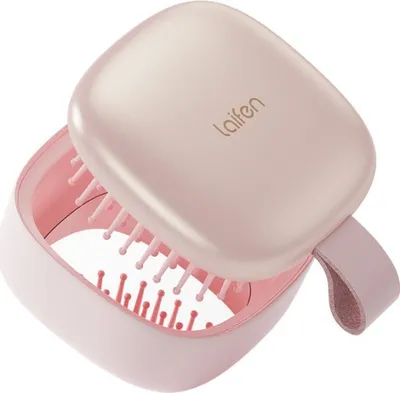 A pink Laifen mini hair brush with its lid open, showing the bristles.