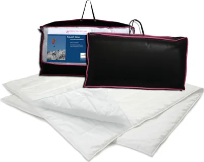 A product shot of a comforter set in its packaging and laid out.