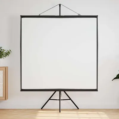 A white projection screen on a black tripod stand is set up against a white wall, with a wooden cabinet and a plant visible on the left.