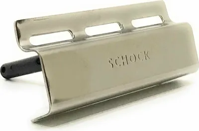 A close-up studio shot of a stainless steel sink overflow cover with a black pin.