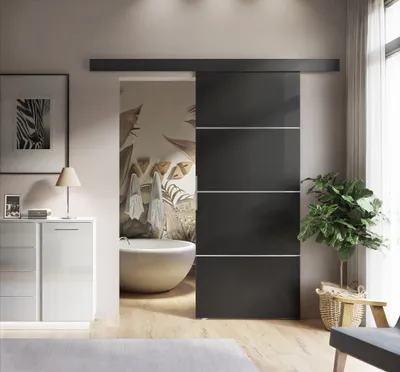 A modern bathroom with a sliding door, bathtub, and vanity.