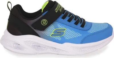 A side view of a single blue and black children's sneaker with green accents.