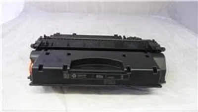 A black toner cartridge is shown on a white background.
