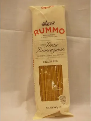 A package of Rummo Bucatini pasta against a neutral background.