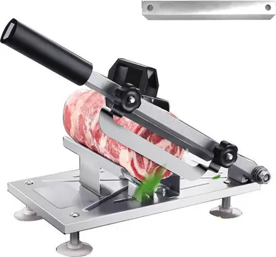 A manual meat slicer with a piece of meat on it, ready to be sliced.