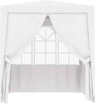 A white party tent with curtains and a window.