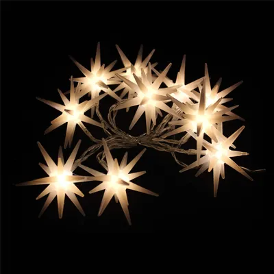 A string of star-shaped lights against a black background.