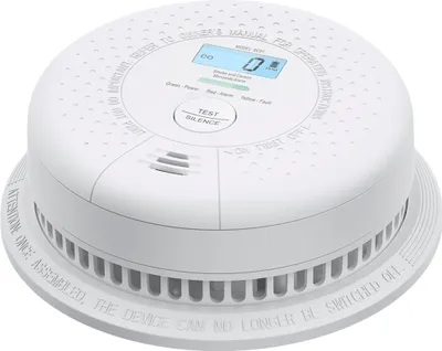 A white combination smoke and carbon monoxide detector is shown from a slightly elevated angle against a white background.