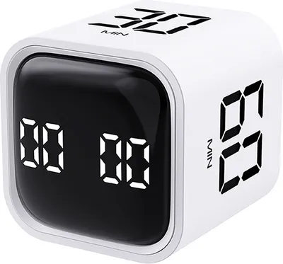 A white cube timer with a digital display.