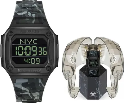A Philipp Plein Hyper Shock watch is displayed next to its packaging, which is shaped like a skull.