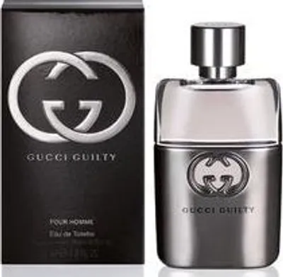 A product shot of Gucci Guilty Pour Homme eau de Toilette for men, showing both the perfume bottle and its packaging.