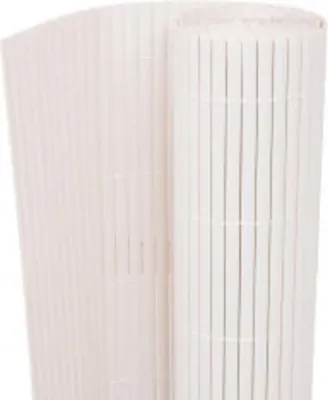A rolled-up white garden fence made of vertical slats.
