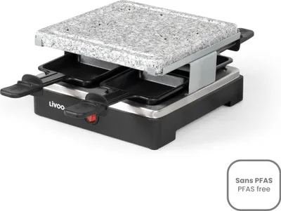 A raclette grill with a granite top plate and four small pans.