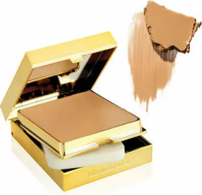 A compact of Elizabeth Arden Flawless Finish Sponge-On Cream Makeup in a gold case, with a swatch of the makeup next to it.
