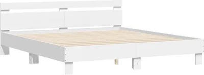 A white bed frame with a slatted base is shown against a white background.
