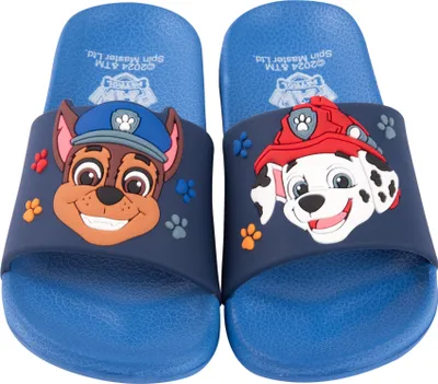A pair of blue Paw Patrol themed children's slide sandals, featuring characters Chase and Marshall.