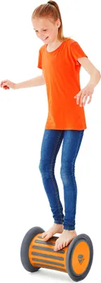 A young girl is standing on a balance roller.
