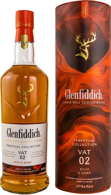 A bottle of Glenfiddich Perpetual Collection Vat 02 Rich & Dark whisky next to its cylindrical packaging.