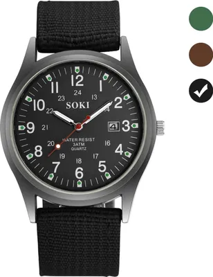A close-up studio shot of a black men's wristwatch with a black fabric strap.