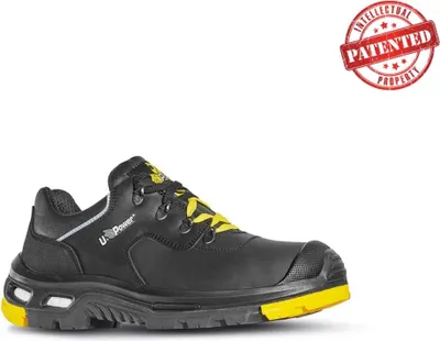 A black and yellow safety shoe is shown against a white background.
