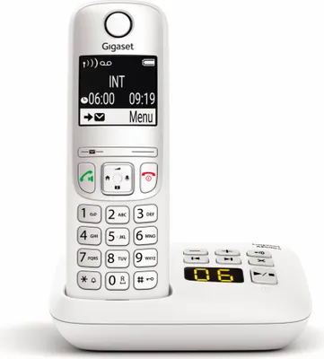 A white cordless phone and its charging base are displayed against a white background.