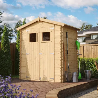 A wooden garden shed with gardening tools leaning against it, set in a backyard with a paved patio and garden plants.