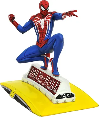 A Spider-Man figurine is posed dynamically on top of a yellow taxi with a Daily Bugle newspaper sign.