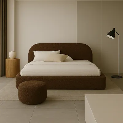 A minimalist bedroom scene featuring a large bed.