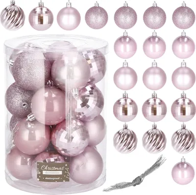 A collection of pink Christmas ornaments in a clear plastic container, with additional ornaments displayed around it.
