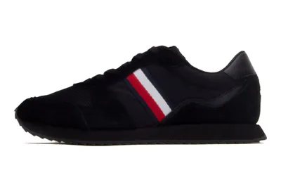 A single black sneaker is shown from the side against a white background.