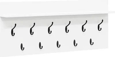 A white wall-mounted coat rack with a shelf and multiple black hooks.