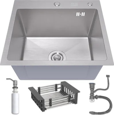 A stainless steel kitchen sink with accessories displayed below it.