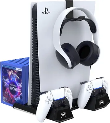 A PlayStation 5 console with accessories, including headphones, controllers, and game cases, displayed on a white background.