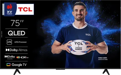 A man holding a rugby ball in front of a TV screen displaying a promotional image.