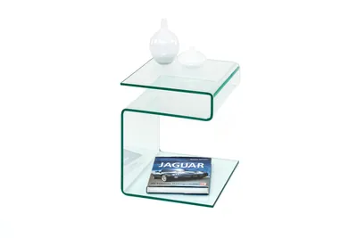 A clear glass side table with two decorative vases and a book on it, isolated on a white background.