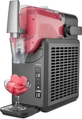 A slush ice maker with a bowl of slush in front of it.