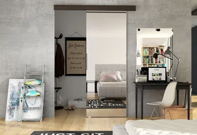 A bedroom with a sliding door, desk, and bed.