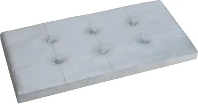 A tufted, light gray upholstered bench viewed from a slightly elevated diagonal angle against a white background.