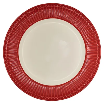 A single red plate with a cream-colored center, viewed from directly above.