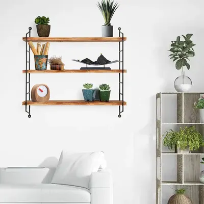 A three-tiered wooden shelf with various decorative items and plants.